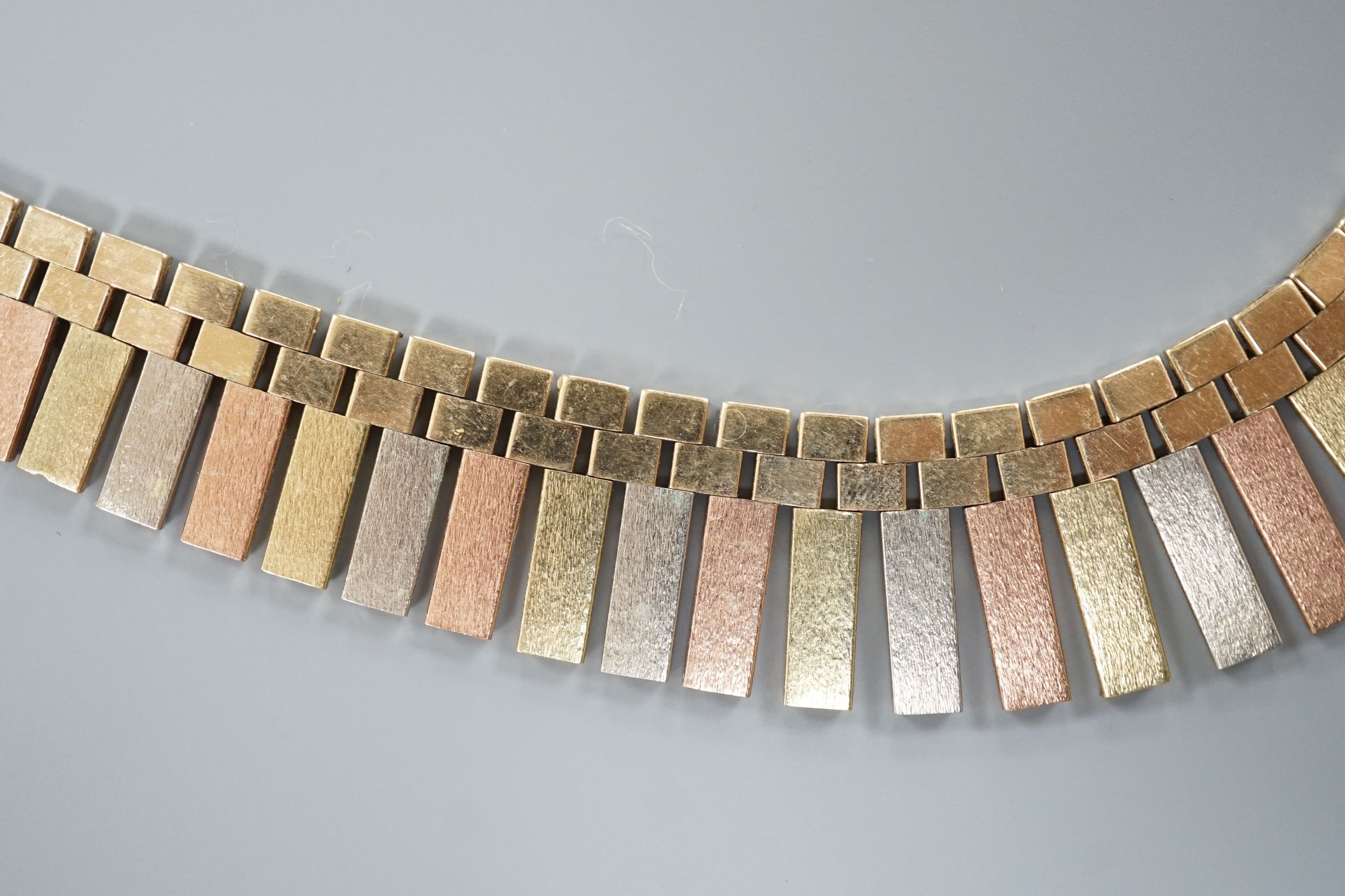 A modern three colour 9ct gold fringe necklace, 40cm, 46.7 grams.